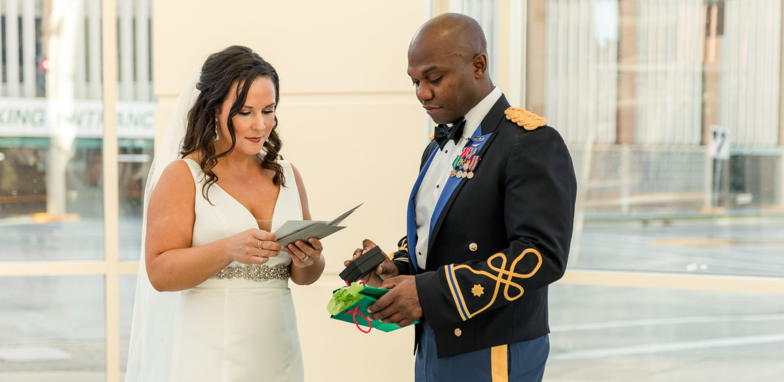 bride and groom exchanging gifts 
