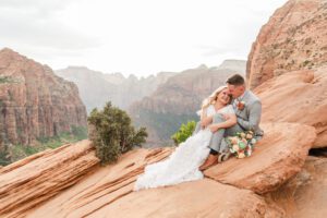 zion national park bridal session, couple sitting at the top of zion national park
