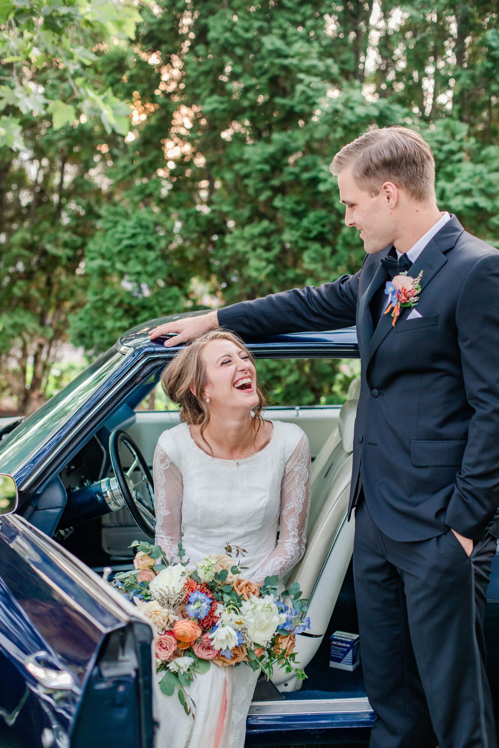 vintage car bride and groom portrait